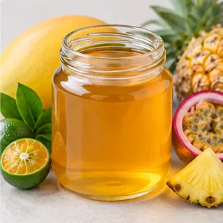 Golden tropical fruit concentrate in a glass jar