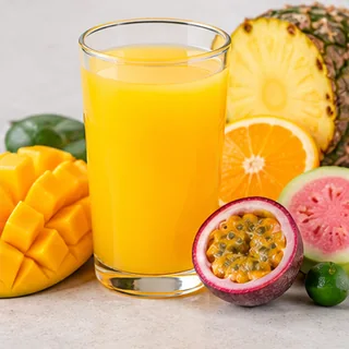 Glasses of colorful tropical fruit juices
