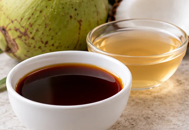 Bowls of coconut aminos and pale vinegar