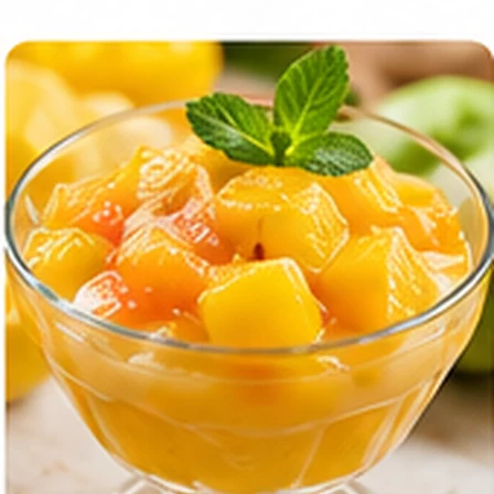 Tropical fruit pudding with fruit pieces in a glass bowl