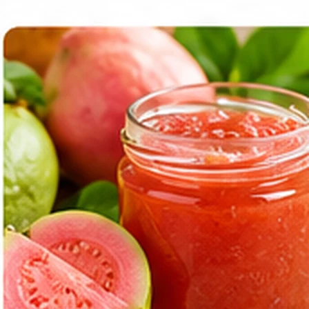 Red guava jam in a glass jar with guava fruit