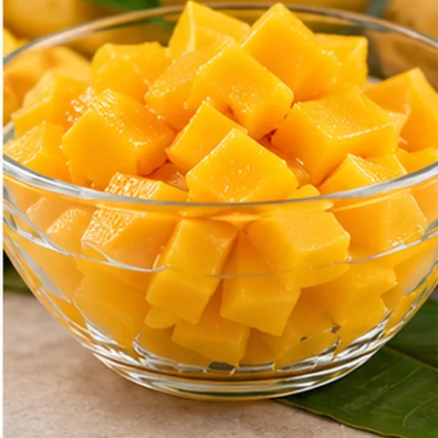 Chilled yellow mango cubes in a bowl