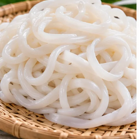 Pale rice noodles prepared for palabok