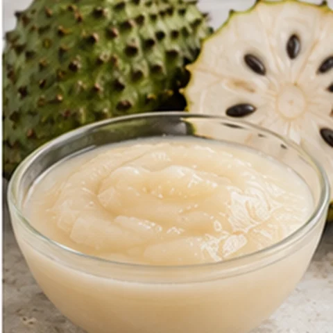 Pale soursop purée with cut soursop fruit