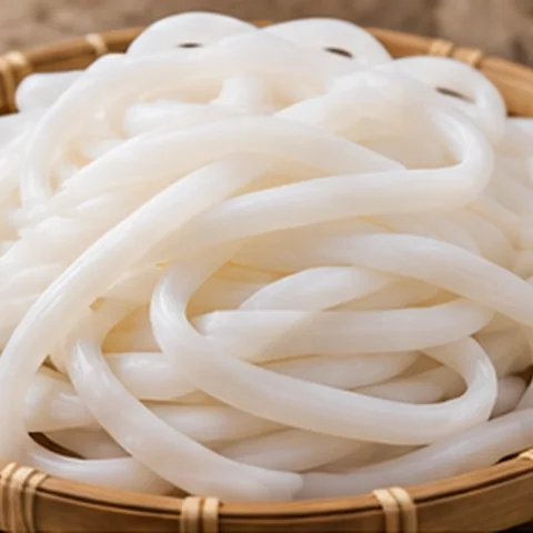 White cornstarch noodles curled in a loose bundle