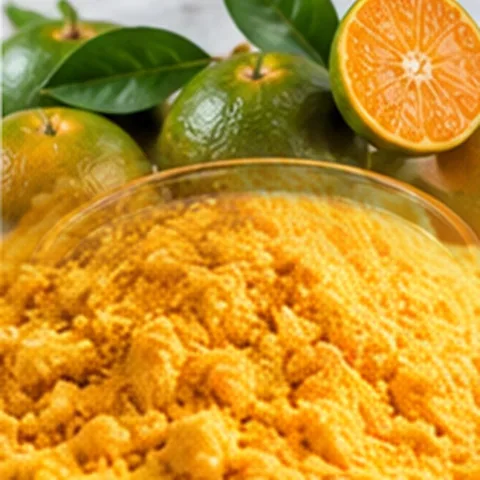 Fine orange-colored citrus powder beside dalandan fruit